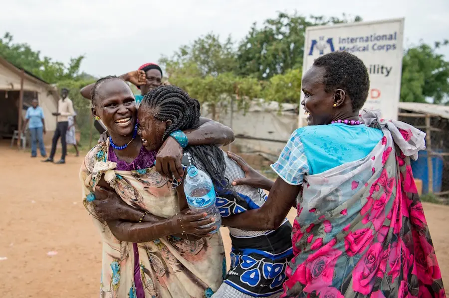 Women Hugging with Water