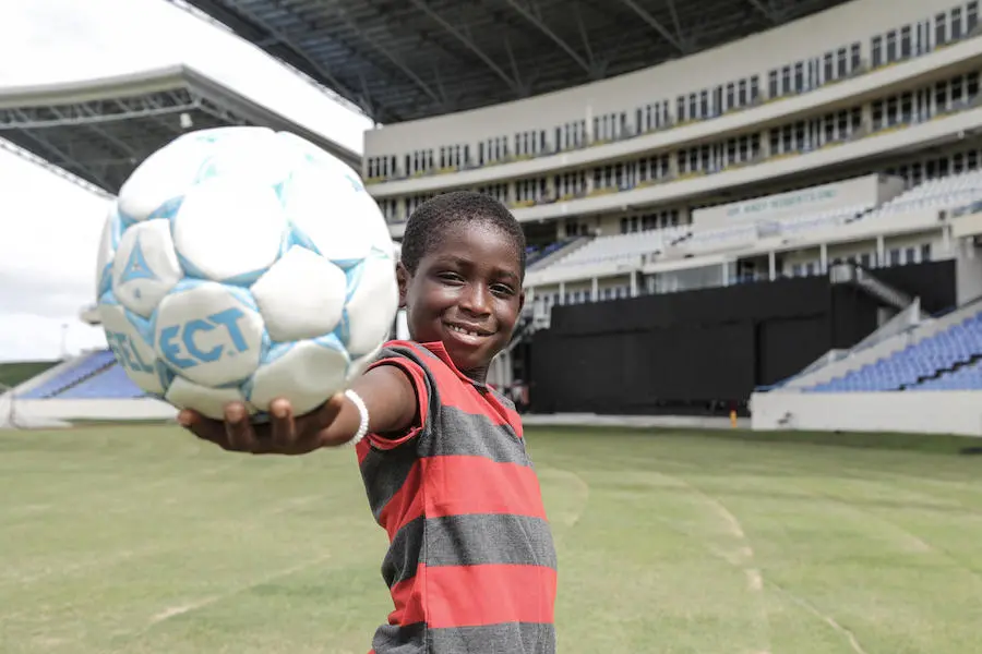 In September 2017, 9-year-old Unique holds a soccer ball at the Antigua Recreation Ground (Antigua and Barbuda's national stadium). The stadium is being used as a shelter for families displaced by Hurricane Irma. unicef, unicef usa, hurricane irma, antigua, barbuda, joy of soccer, soccer football, displaced children