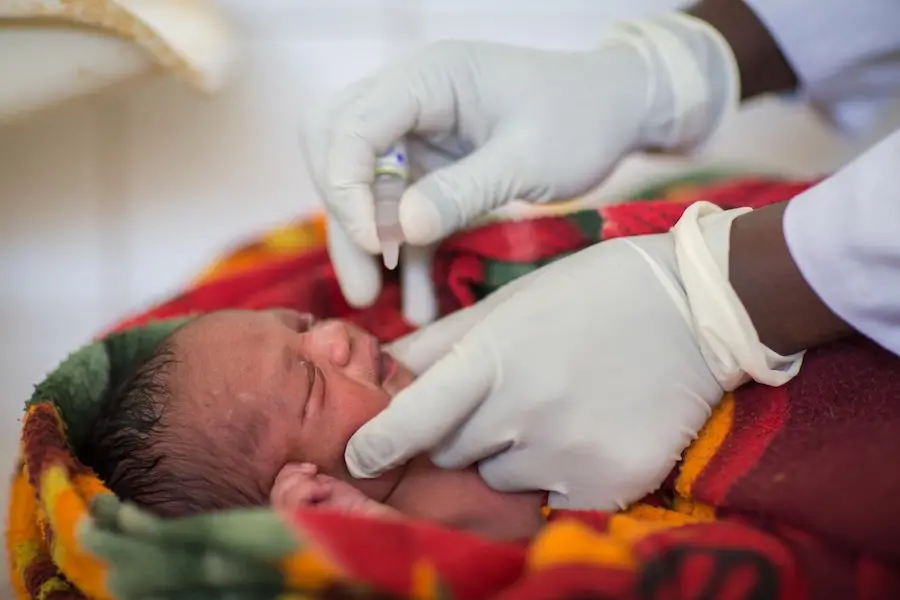 One-day-old Musa Mohammed receives oral polio vaccine at the UNICEF-supported Homosha district health center in Benishangul-Gumuz, Ethiopia. One-day-old Musa Mohammed receives oral polio vaccine at the UNICEF-supported Homosha district health center in Benishangul-Gumuz, Ethiopia.