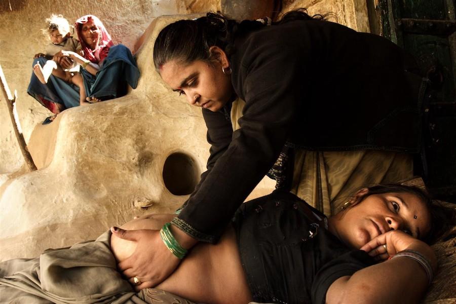 Vinita Kalra, a midwife, performs an antenatal checkup during a home visit in Rajasthan State, India.