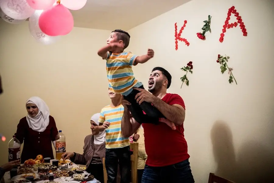 Family Playing with Balloons