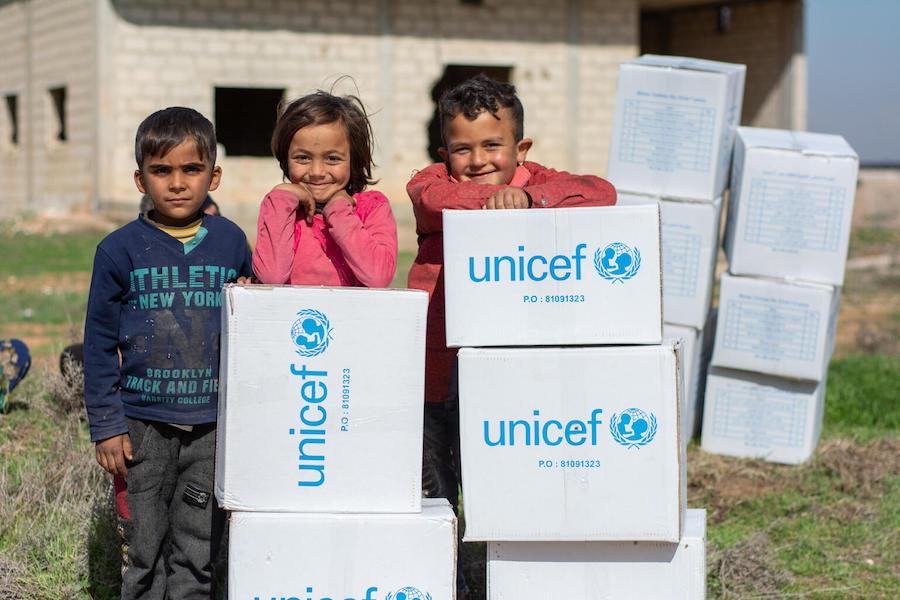 Children Posing with UNICEF Boxes