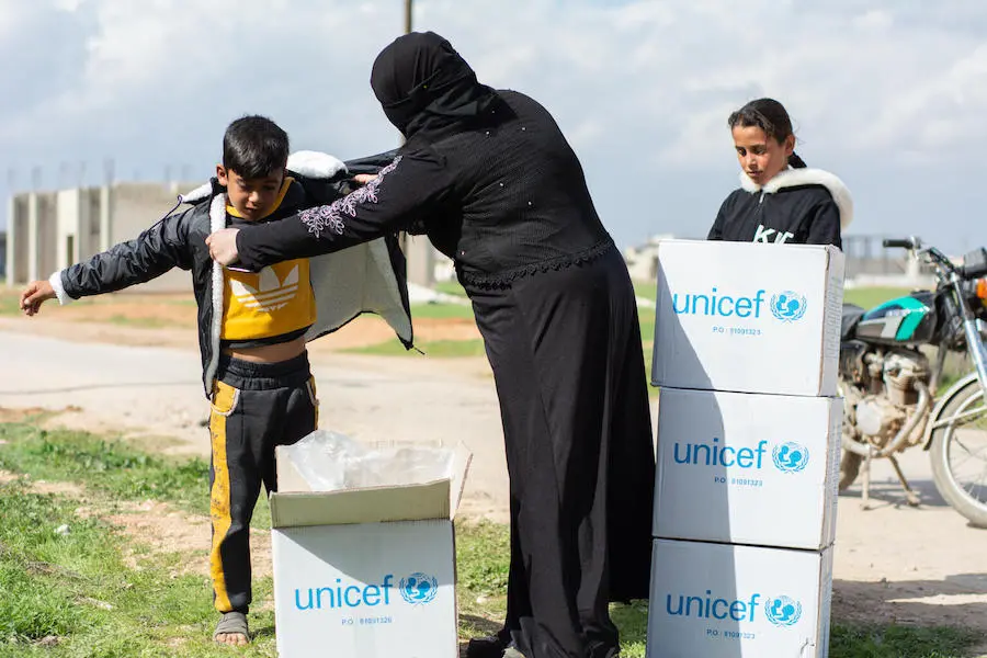 Family Opening UNICEF Box
