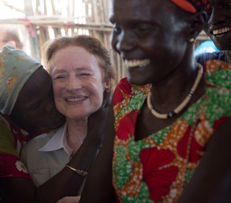 In South Sudan, grateful mothers who have been reunited with their missing children hug UNICEF Executive Director Henrietta Fore.
