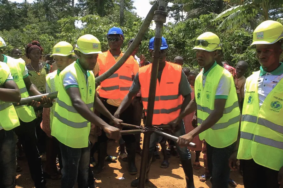 A manually-operated auger, or drilling device, is used to access underground sources of safe water in rural Guinea. A manually-operated auger, or drilling device, is used to access underground sources of safe water in rural Guinea.