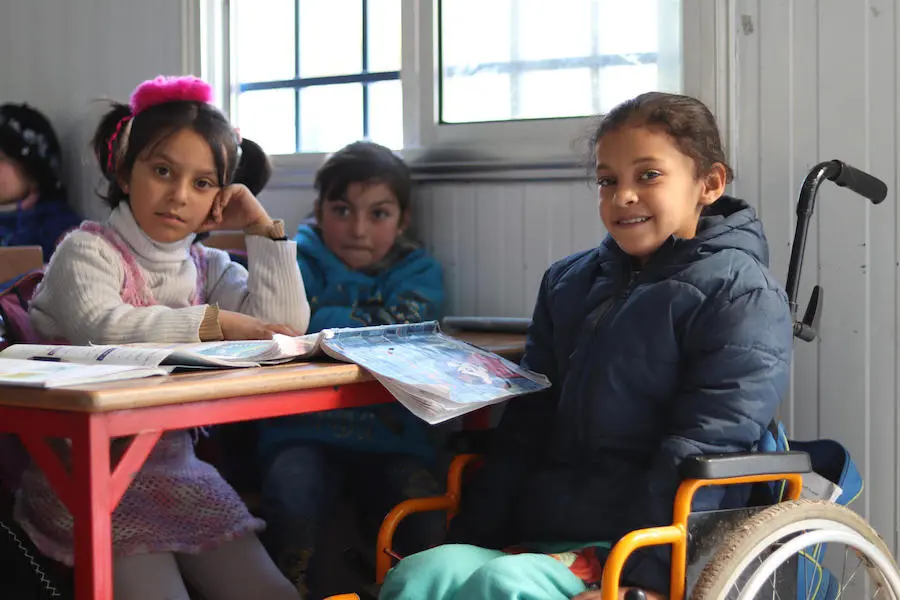 After Hanaa, 8, was paralyzed by a bomb blast in East Aleppo, Syria, volunteers at a UNICEF-supported Child-Friendly Center helped her overcome her fears and start learning and playing again. After Hanaa, 8, was paralyzed by a bomb blast in East Aleppo, Syria, volunteers at a UNICEF-supported Child-Friendly Center helped her overcome her fears and start learning and playing again.