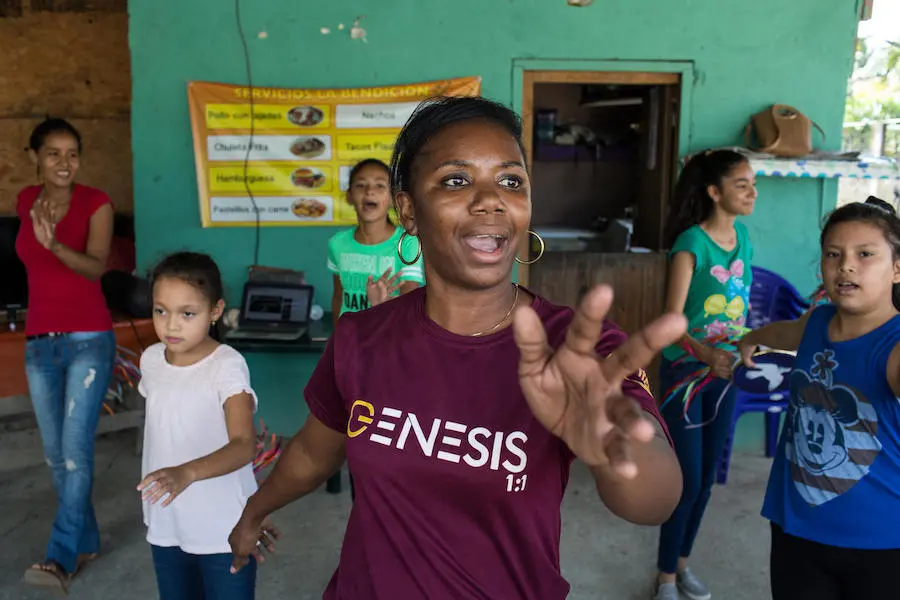 Ingrid Castrillo, 34, dance withe young girls at the community center where she teaches in Puerto Cortes, Honduras. unicef, honduras, violence in central america