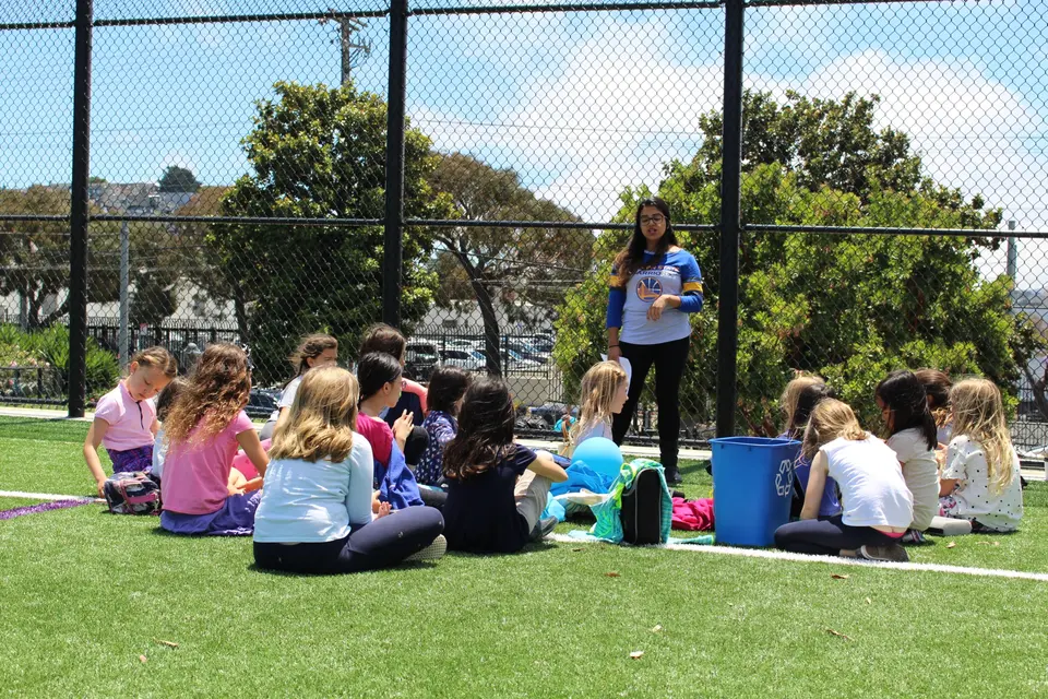 Woman Speaking to Group of Kids
