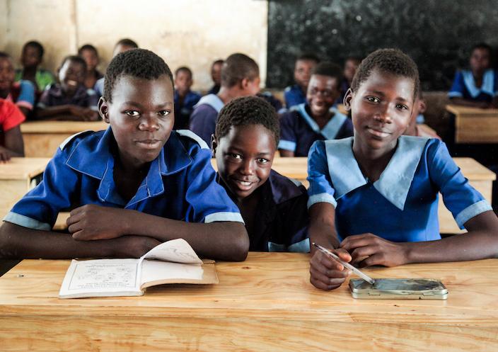 Students at Sotodwa Primary School in Chikwawa, Malawi, sit proudly at their new desks, provided by the K.I.N.D. Fund.