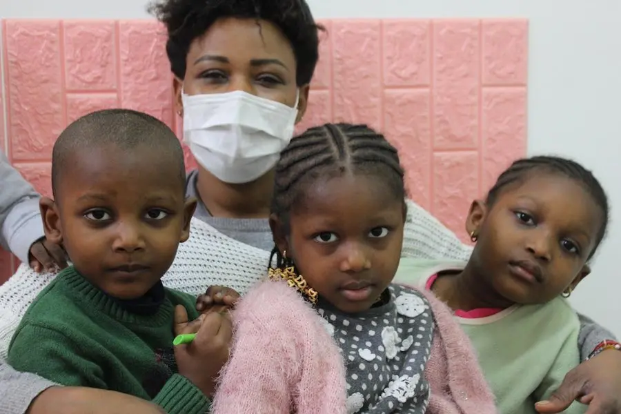 Woman with Mask Posing with Children