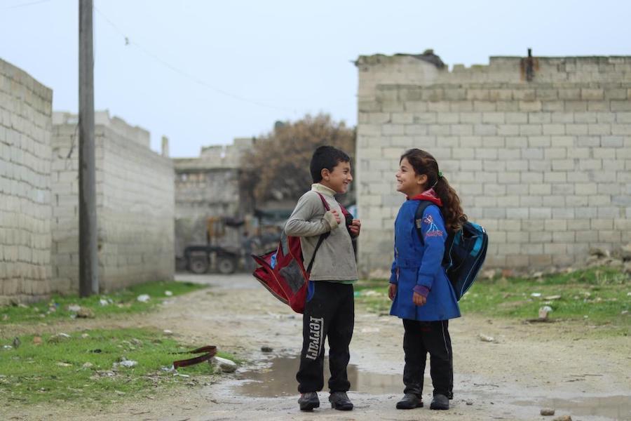 Zahra, 7, walks to school with her friend in Karm Al- Nezha neighborhood of east Aleppo. “I choose the long way to school because it’s less muddy,” she says. Photo: UNICEF/ Syria 2018/ Khudr Al- Issa 