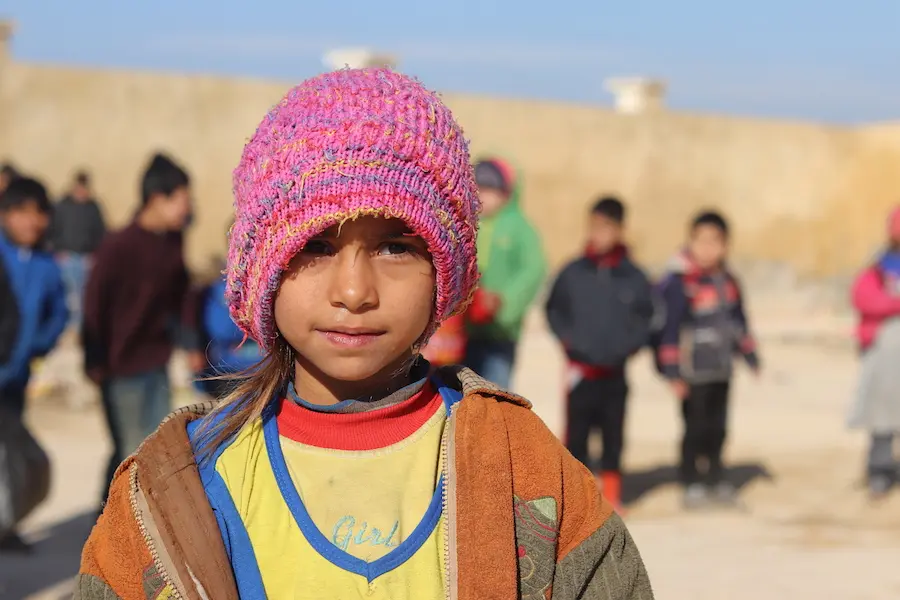 Maryam, 9, plays at recess in front of a school serving as a center for the UNICEF-supported self-learning program in northern rural Aleppo, Syria Maryam, 9, plays at recess in front of a school serving as a center for the UNICEF-supported self-learning program in northern rural Aleppo, Syria.