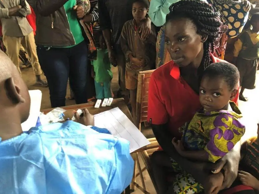 Woman and Child Talking to Health Provider