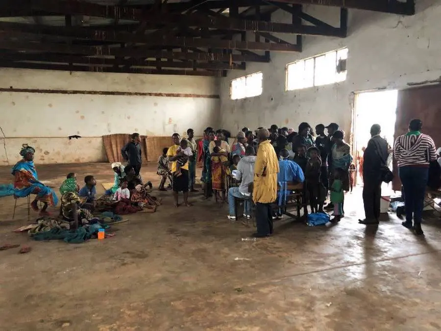 Group of People in an Empty Building