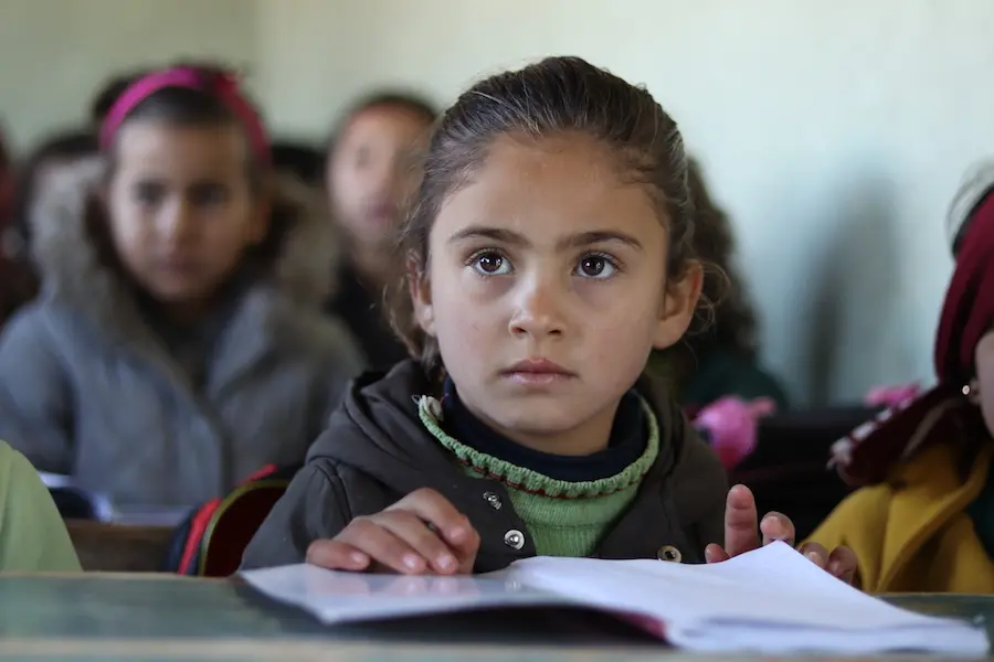 Nour, 7, attends a UNICEF-supported self-learning session in Qaramel village in northern rural Aleppo, Syria. Nour, 7, attends a UNICEF-supported self-learning session in Qaramel village in northern rural Aleppo, Syria.