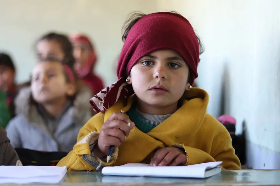 Heyam, 7, attends a UNICEF-supported self-learning session in Qaramel village in northern rural Aleppo, Syria. Heyam, 7, attends a UNICEF-supported self-learning session in Qaramel village in northern rural Aleppo, Syria.