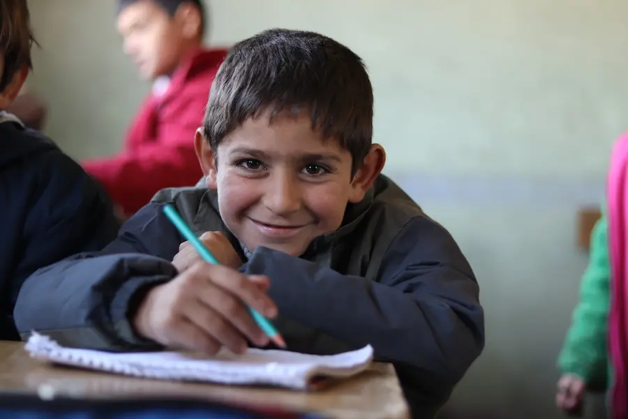 Ali, 7, attends a UNICEF-supported self-learning session in Qaramel village in northern rural Aleppo, Syria. Ali, 7, attends a UNICEF-supported self-learning session in Qaramel village in northern rural Aleppo, Syria.