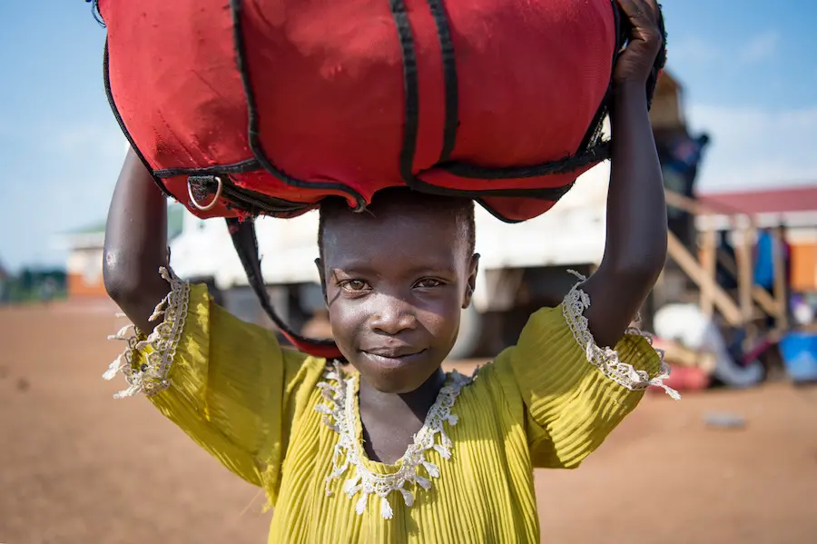 South Sudanese refugee Anna, 5, waits for her family to be registered at the UNHCR arrivals center on the Ugandan border. South Sudanese refugee Anna, 5, waits for her family to be registered at the UNHCR arrivals center on the Ugandan border.