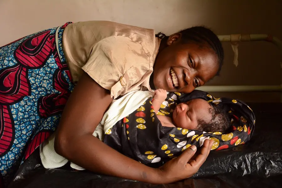 Woman Hugging Baby