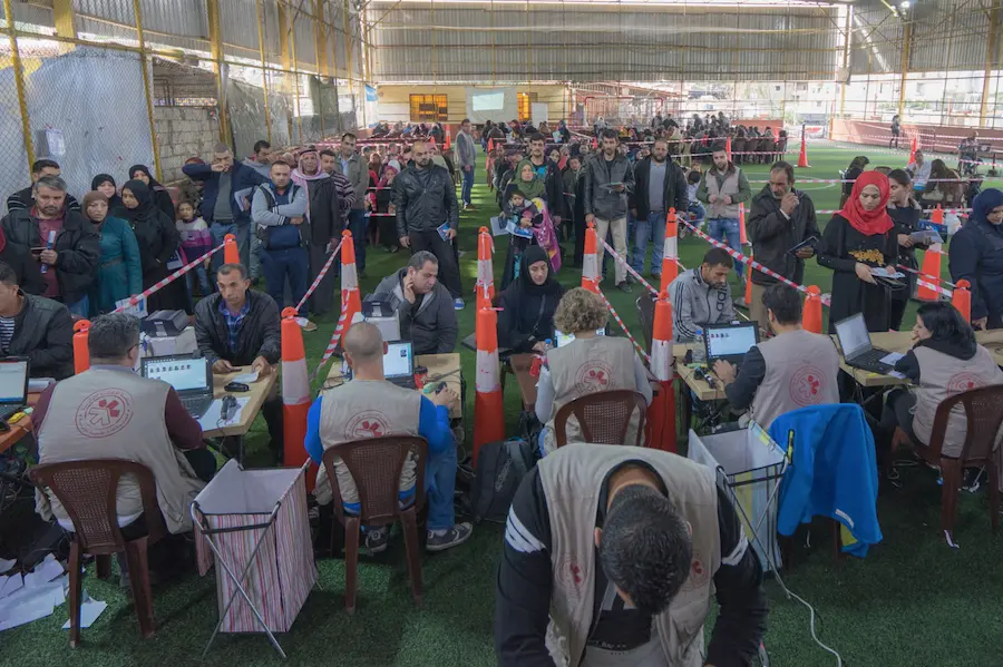 Syrian refugees lined up to have their data verified before receiving a LOUISE benefit card in Khaldeh, Greater Beirut, in December 2017. Syrian refugees lined up to have their data verified before receiving a LOUISE benefit card in Khaldeh, Greater Beirut, in December 2017.