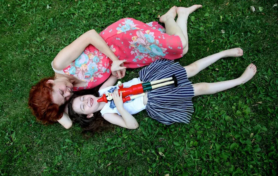 Two People Laying in the Grass