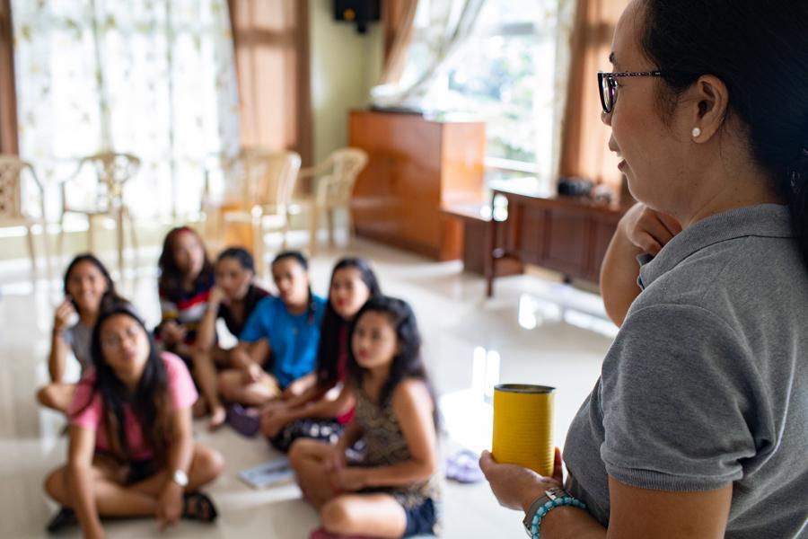 Adult Speaking to Group of Girls