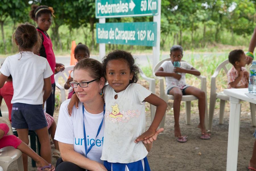UNICEF Child Protection office with a girl at a child-friendly space for Ecuadorians displaced by the April earthquake.