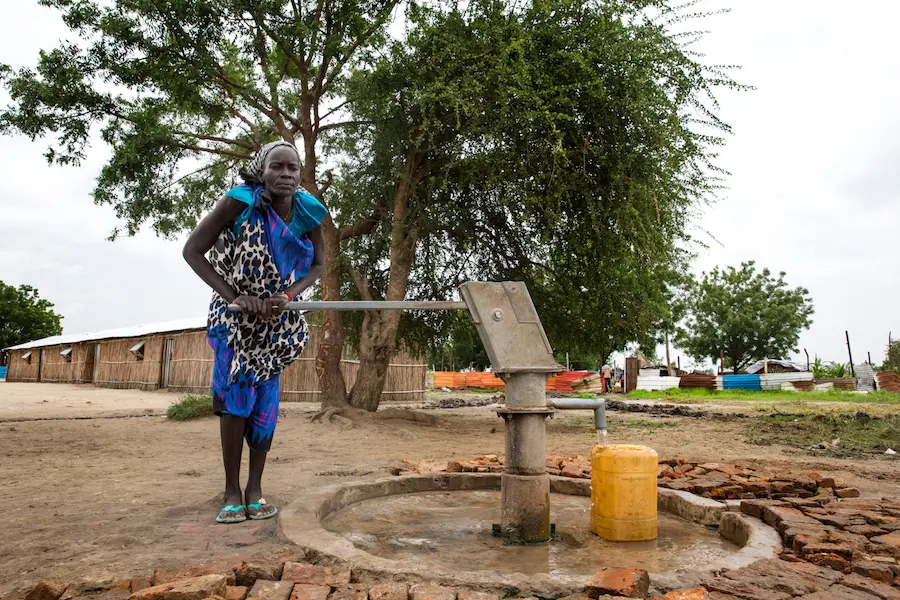 Angelina pumps water into a jerry can at the Machakos Primary School, Bentiu, South Sudan, July 2017. Angelina pumps water into a jerry can at the Machakos Primary School, Bentiu, South Sudan, July 2017.