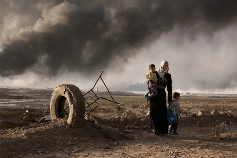 Women and Children Surrounded by Smoke