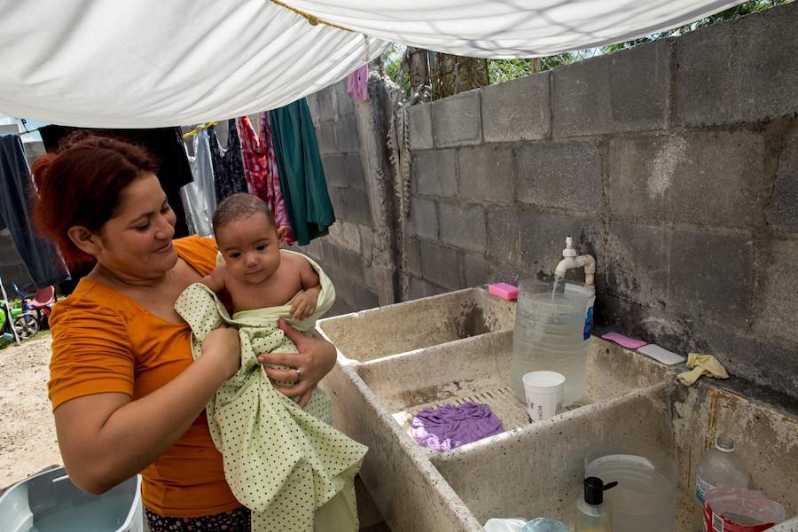 Woman Washing Baby