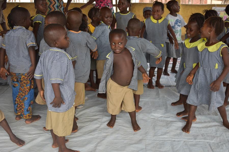 Children dance at the Meferey Early Childhood Development Center, Bombali District. UNICEF Sierra Leone. 