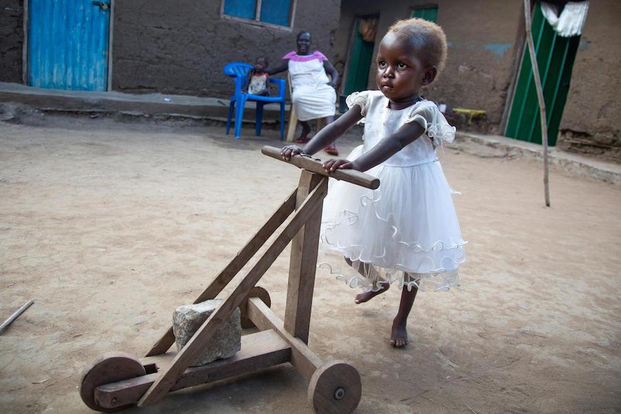 Treated for severe acute malnutrition at a UNICEF-supported health center in Juba, South Sudan, two-year-old Maria pushes a handmade cart in November 2017.