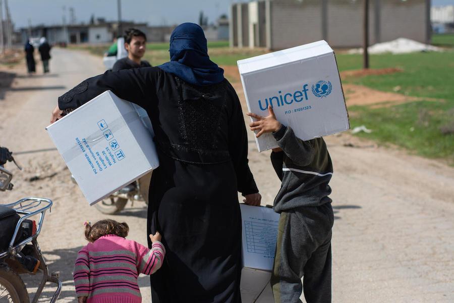 Family with UNICEF Boxes