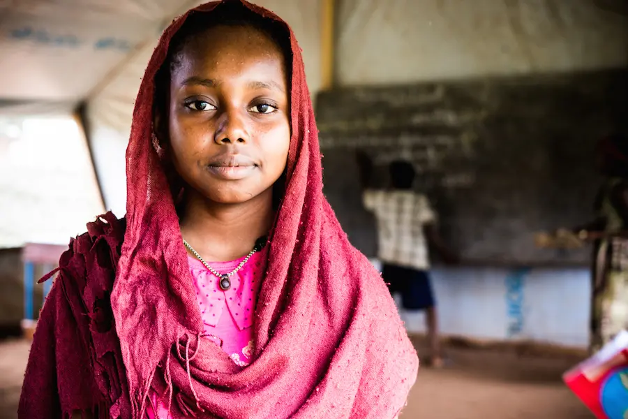Faozea, 14, is a refugee from the Central African Republic living in Chad, where she attends school with UNICEF's support. Faozea, 14, is a refugee from the Central African Republic living in Chad, where she attends school with UNICEF's support.