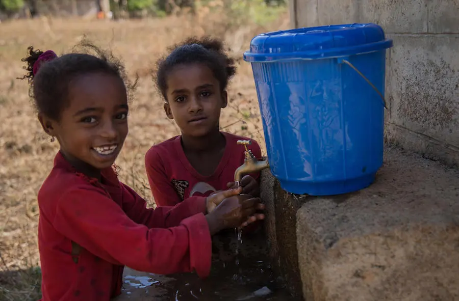 Seven-year-olds Foziya (left) and Hawa wash their hands after using the toilet at Selga number 2 Primary School, Benishangul Gumuz, Ethiopia. UNICEF, World Toilet Day, sanitation, toilets, Ethiopia