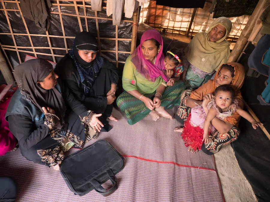 Johora, far left, is a UNICEF-trained Model Mother who visits Rohingya refugee families in Kutapalong Refugee Camp in Cox's Bazar, Bangladesh. Johora, far left, is a UNICEF-trained Model Mother who visits Rohingya refugee families in Kutapalong Refugee Camp in Cox's Bazar, Bangladesh.