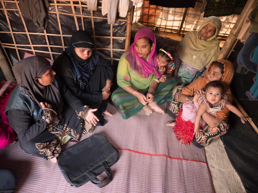 Johora, far left, is a UNICEF-trained Model Mother who visits Rohingya refugee families in Kutapalong Refugee Camp in Cox's Bazar, Bangladesh. 