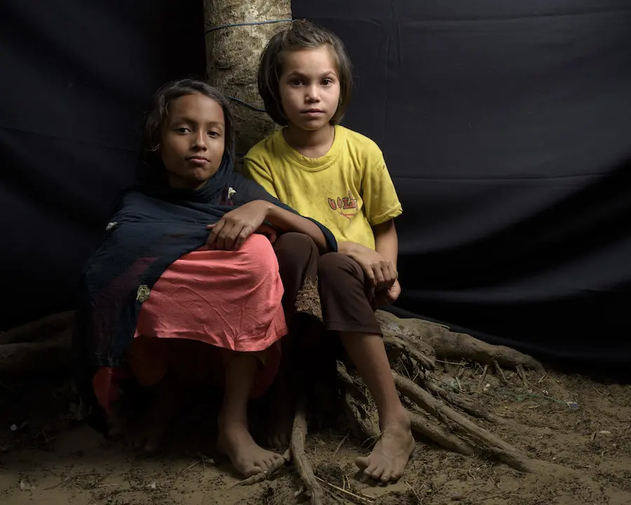Two Kids Sitting on Tree
