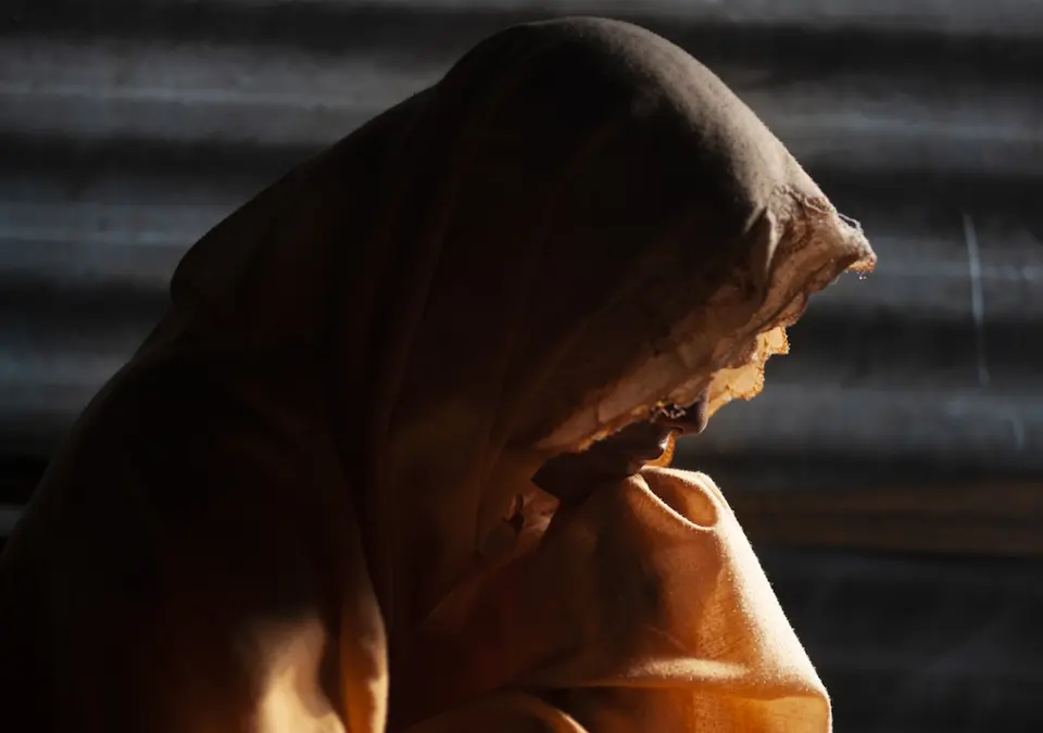 Silhouette of Person with Head Scarf