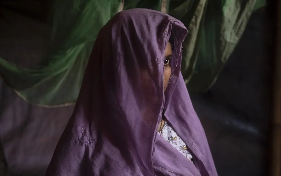 Girl with Eye Peeking Out From Head Scarf