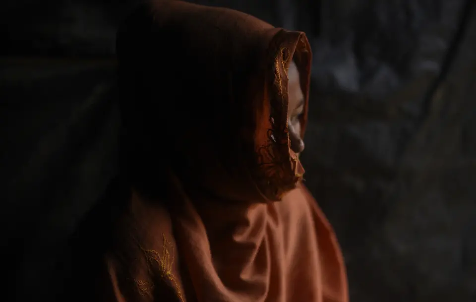 Person Looking Out From Head Scarf
