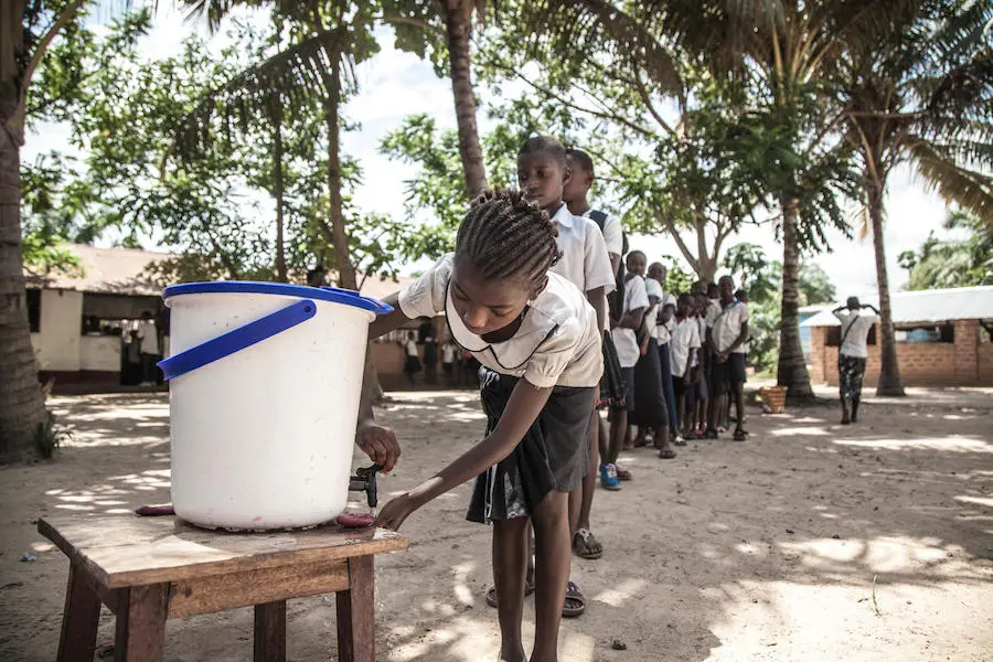 On 22 May 2018, children wash their hands to help contain the Ebola outbreak before entering a classroom in the north-western city of Mbandaka, in the Democratic Republic of the Congo. unicef, ebola, democratic republic of the congo