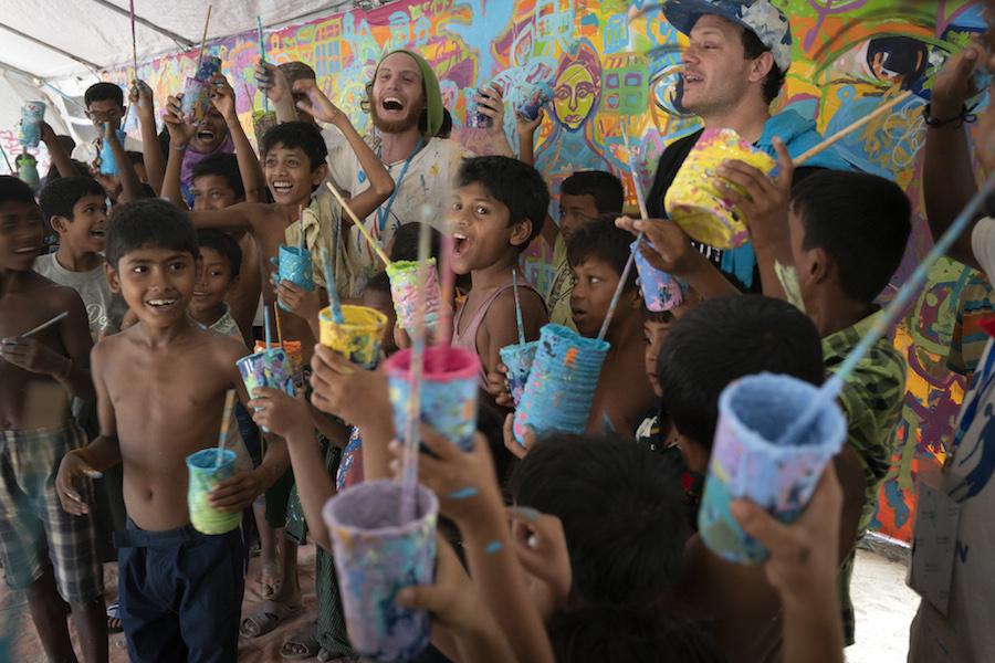American artists volunteered with UNICEF to help Rohingya refugee children paint a mural as part of a public arts exchange.