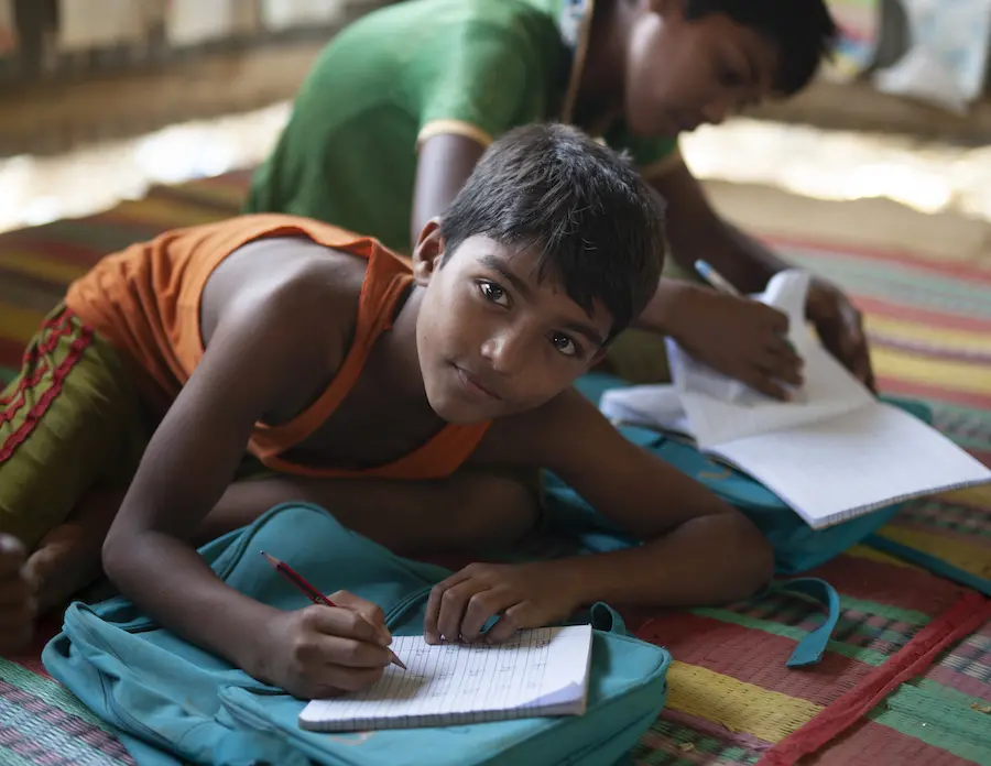 Boy Writing in Notebook