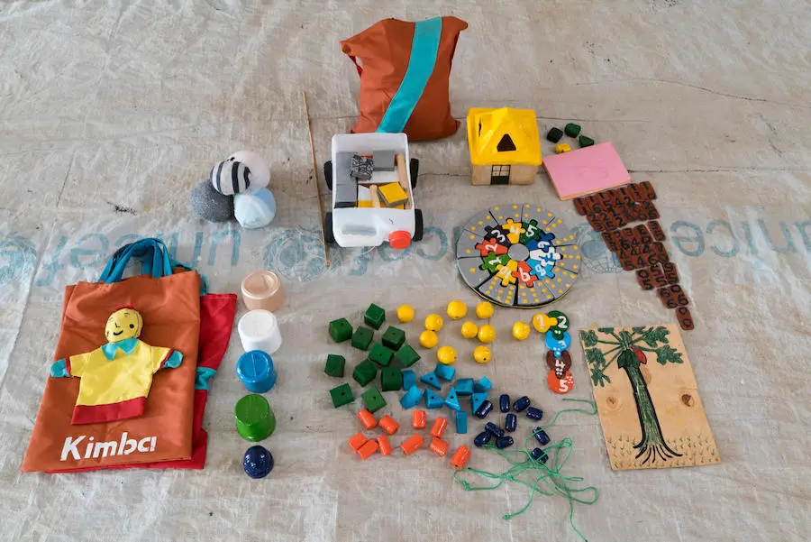 South Sudanese refugee baby playing with locally made sponge ball in Uganda's Yumbe district. A kit of educational toys made by South Sudanese with low-cost materials thanks to UNICEF training.