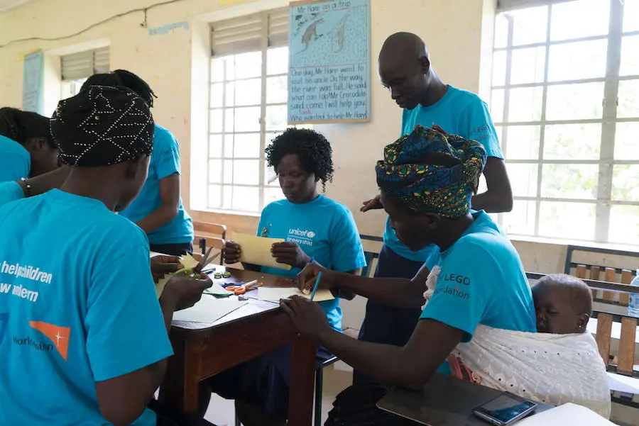Led by UNICEF-supported instructors, caregivers make educational toys at St. John Bosco Primary Teachers College in Londonga, Uganda. Led by UNICEF-supported instructors, caregivers make educational toys at St. John Bosco Primary Teachers College in Londonga, Uganda.