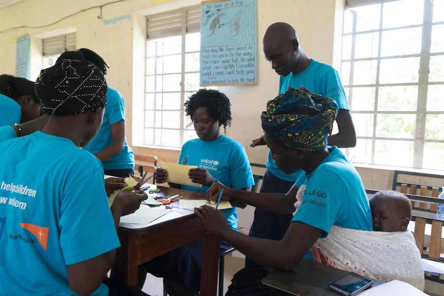 Led by UNICEF-supported instructors, caregivers make educational toys at St. John Bosco Primary Teachers College in Londonga, Uganda.