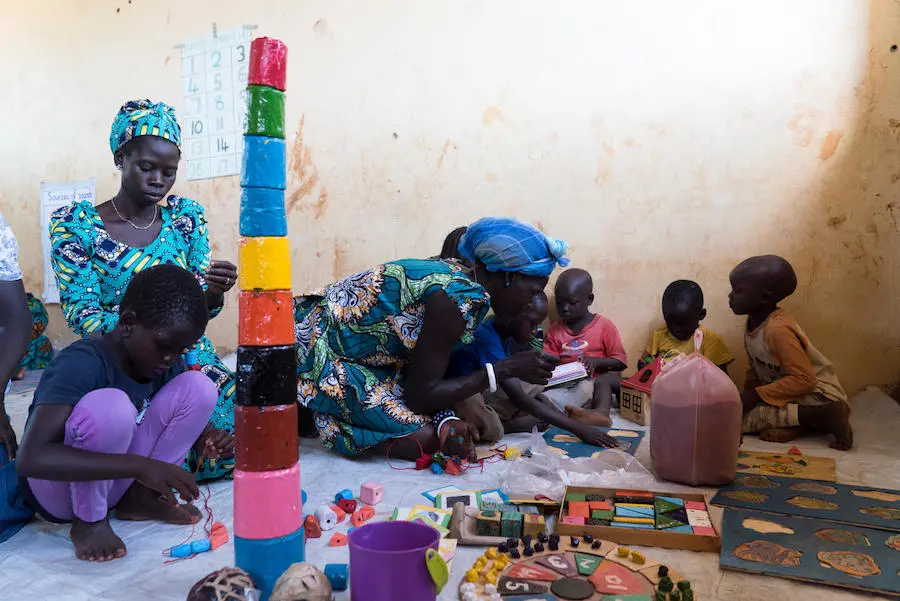 South Sudanese refugee children play with locally made toys at Bright Early Childhood Center, Yumbe District, Uganda. South Sudanese refugee children play with locally made toys at Bright Early Childhood Center, Yumbe District, Uganda.