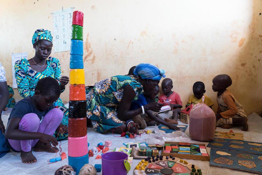 South Sudanese refugee children play with locally made toys at Bright Early Childhood Center, Yumbe District, Uganda. 