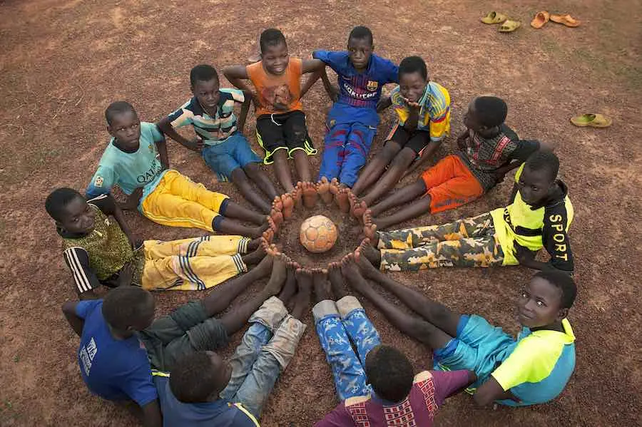 Education is vital for every child to flourish in life, especially in conflict effected areas, where children need help learning how to read and form the connections that make for peaceful environments. Above, a group of boys take a time out from their so Education is vital for every child to flourish in life, especially in conflict effected areas, where children need help learning how to read and form the connections that make for peaceful environments. Above, a group of boys take a time out from their so